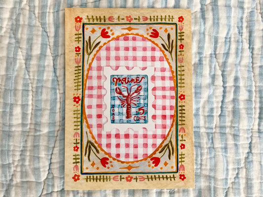 Decorative art print with a checkered design and lobster stamp on a striped fabric background